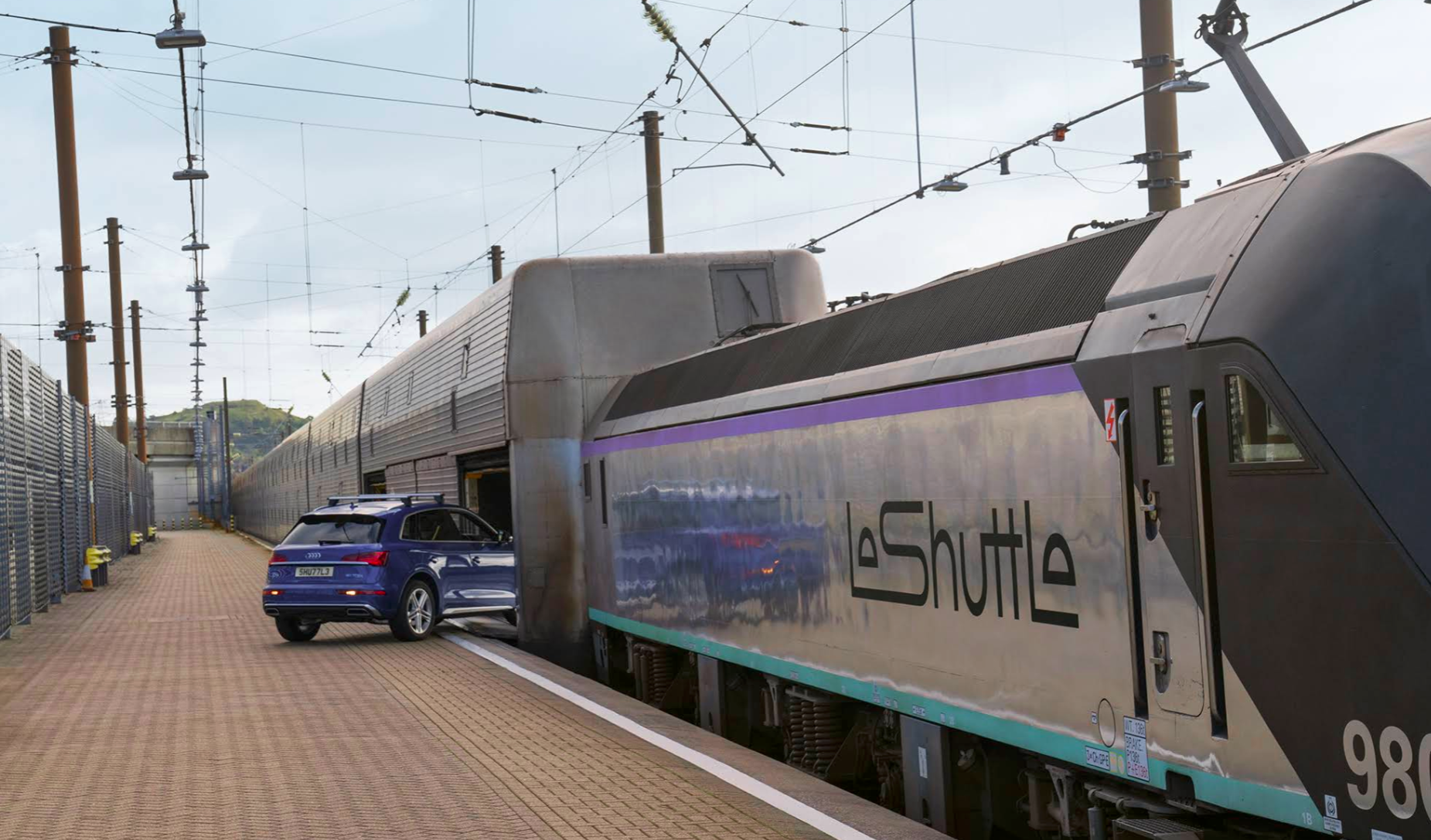 Emergency response vehicles and flashing blue lights at Eurotunnel terminal in Coquelles